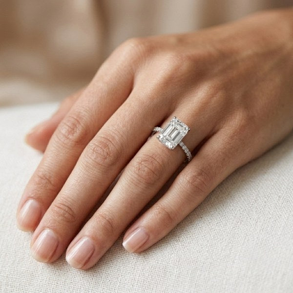 Lifestyle shot of the custom 3ct emerald shape hidden halo lab grown diamond engagement ring at AJ's Jewelry — Ridgewood Queens NY