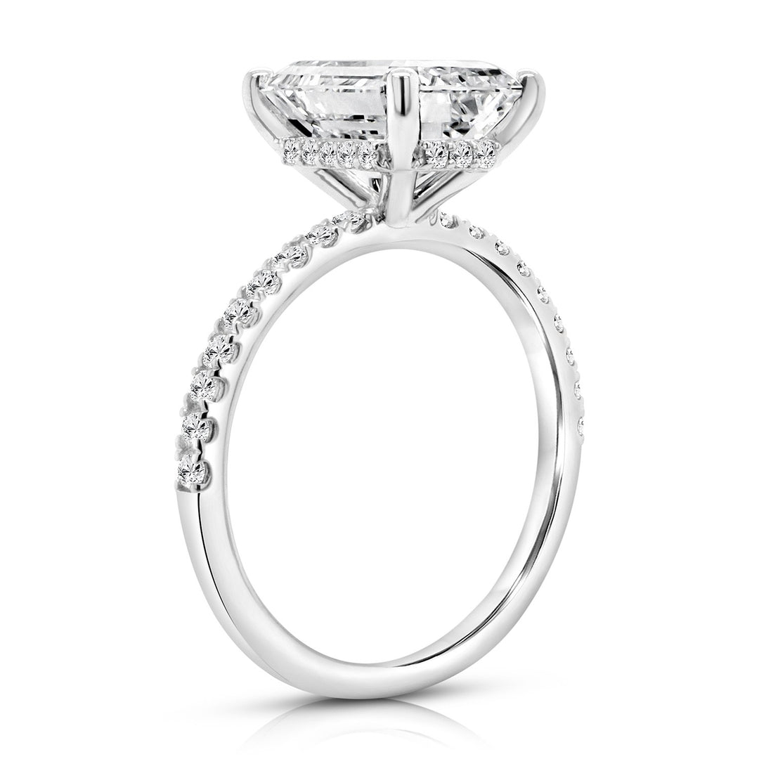 Side profile view of the hidden halo emerald shape lab grown diamond engagement ring in 14 karat white gold — AJ's Jewelry Queens NY