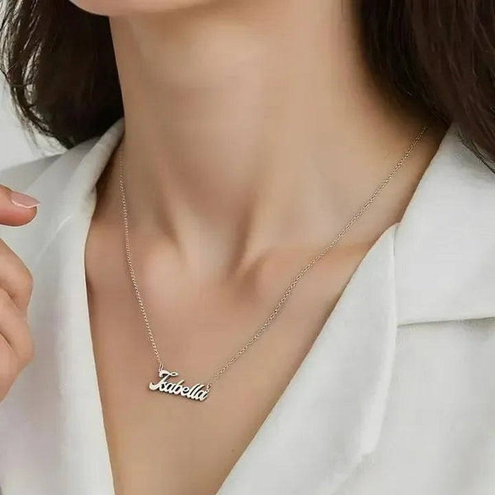 Model wearing the 14 Karat Bold Letter Name Necklace in 14K white gold personalized with the name Isabella | AJ's Jewelry