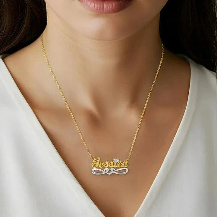 Model wearing the 14 Karat Bold Script Name Necklace with Tail in 14K yellow gold personalized with the name Jessica | AJ's Jewelry