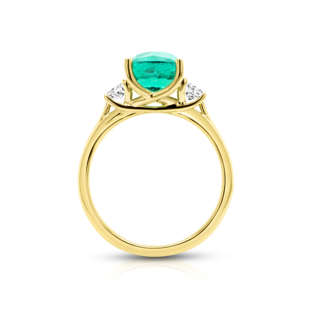 Side profile view of the lab grown emerald 3-stone ring and matching wedding band in 14 karat yellow gold — AJ's Jewelry Queens NY