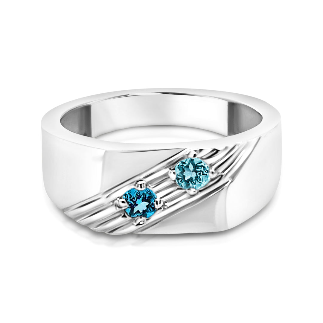 Silver ring with blue gemstones on a white background