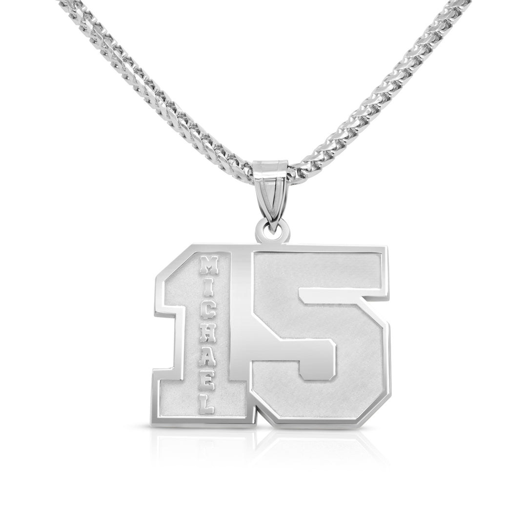 Completed sterling silver personalized jersey number and name pendant laser-engraved and hand-finished by AJ's Jewelry in Ridgewood Queens NY