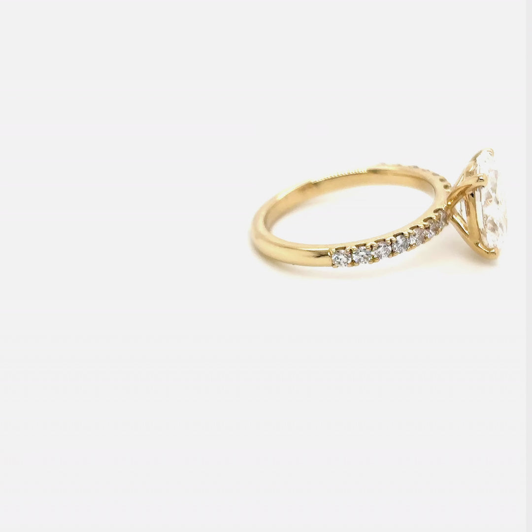 Rotating video of the 14 Karat Gold 2ct oval lab grown diamond pave engagement ring at AJ's Jewelry in Queens, NY