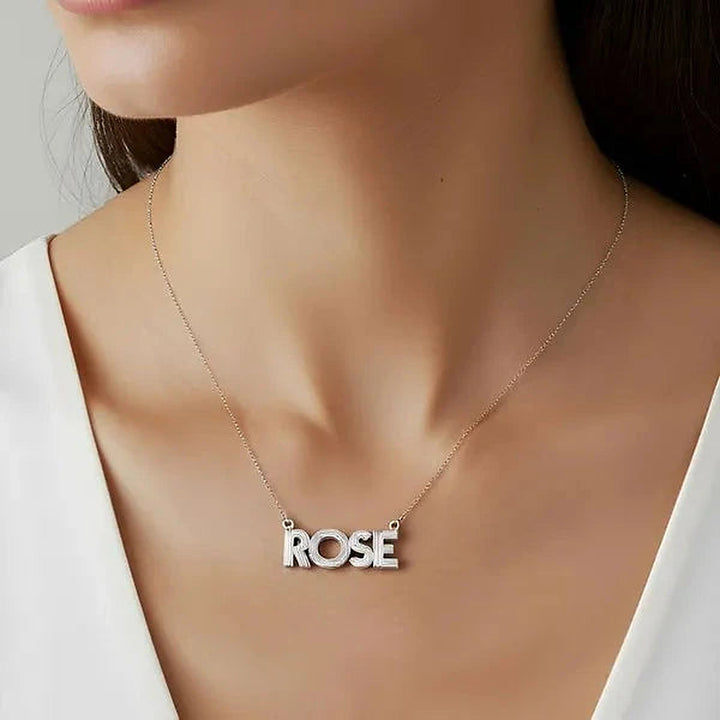 Model wearing the 14 Karat Fluted Name Necklace in 14K white gold personalized with the name Rose | AJ's Jewelry
