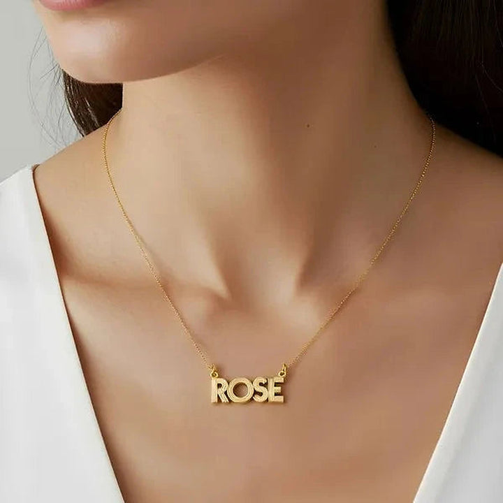 Model wearing the 14 Karat Fluted Name Necklace in 14K yellow gold personalized with the name Rose | AJ's Jewelry