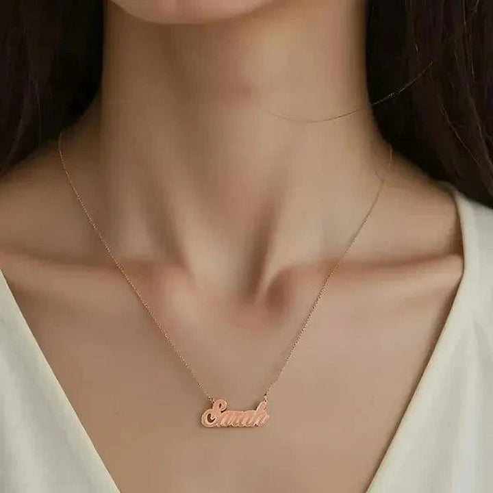Model wearing the 14 Karat Fancy Script Name Necklace in 14K rose gold personalized with the name Sarah | AJ's Jewelry