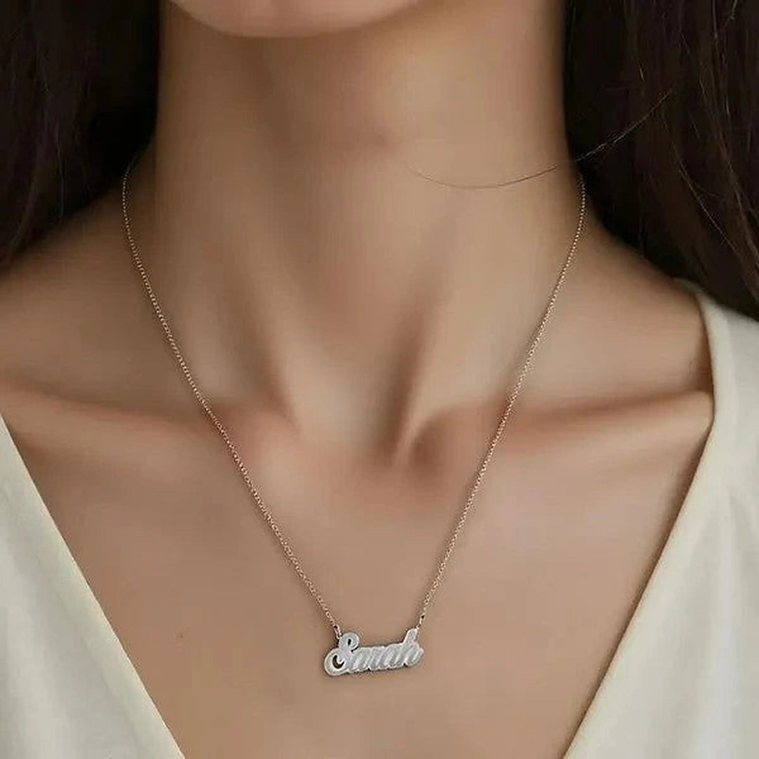 Model wearing the Sterling Silver Fancy Script Name Necklace personalized with the name Sarah | AJ's Jewelry
