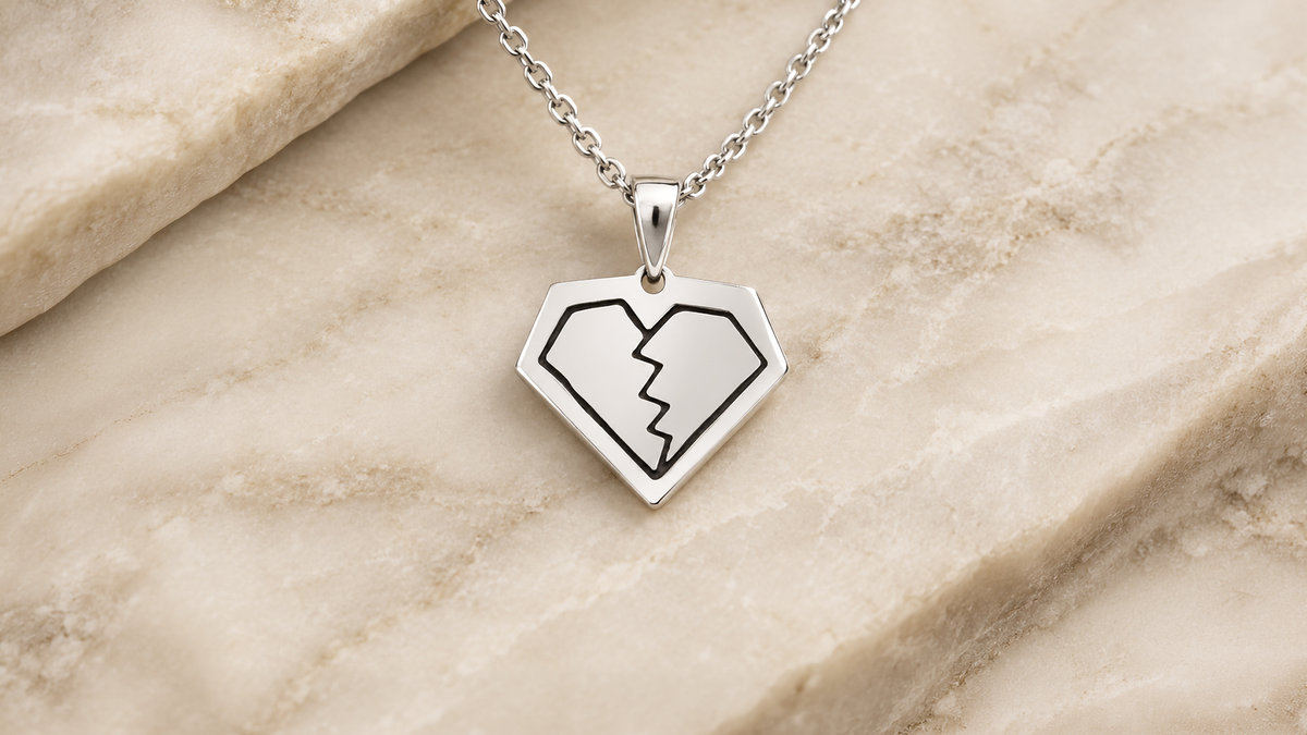 Sterling silver broken diamond pendant with black enamel on a chain, laser engraved and cut from the client's own artwork at AJ's Jewelry in Queens NY